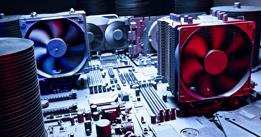 Working graphics card on motherboards with heatsink and fans. Camera moves along computer components.