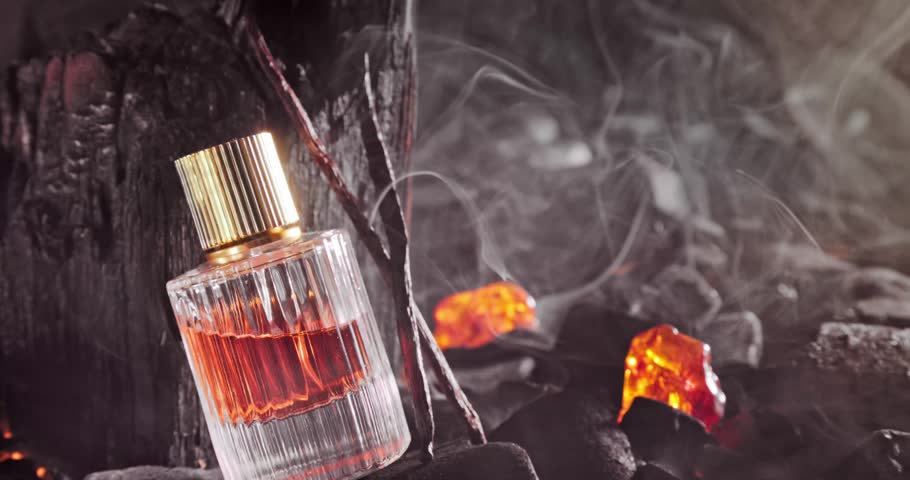 Intense incense perfume with amber, vanilla and incense. Incense perfume on black coal.