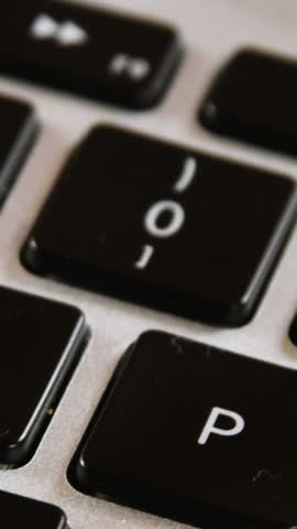 Close-up of figurine of manual worker on a laptop 4k
