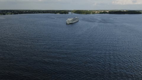 Drone Flying toward Large Ship on Wide