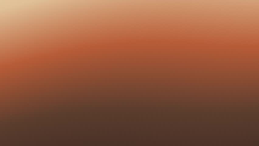 Soft warm colors blending across a hazy landscape during dawn with a smooth gradient and gentle transitions
