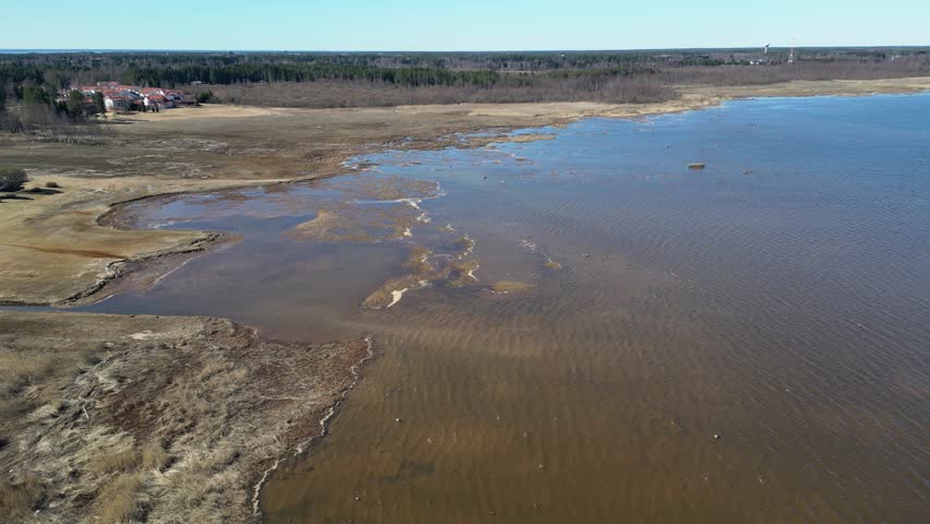 Sunny sea shore in springtime in Vihiluoto, Oulu Finland