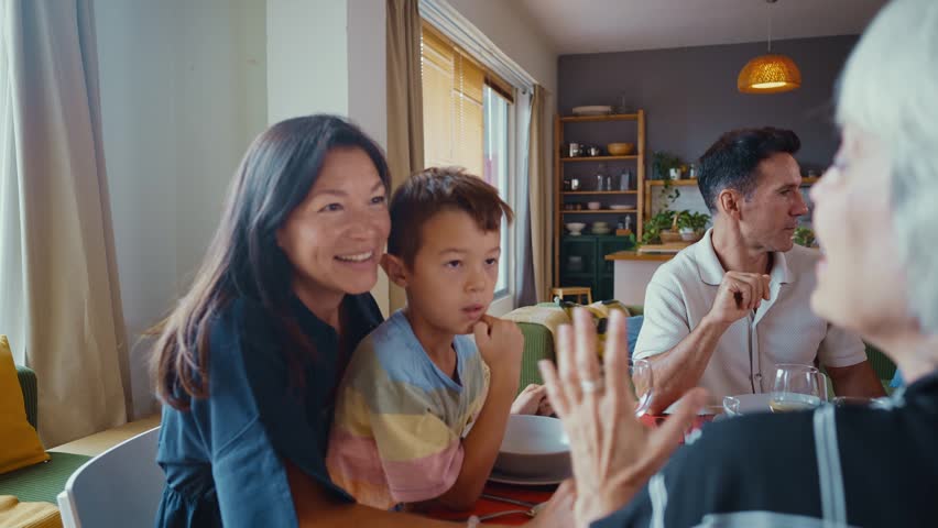 Family and friends reunion at home. Multi-generational family gathering having lunch at home	