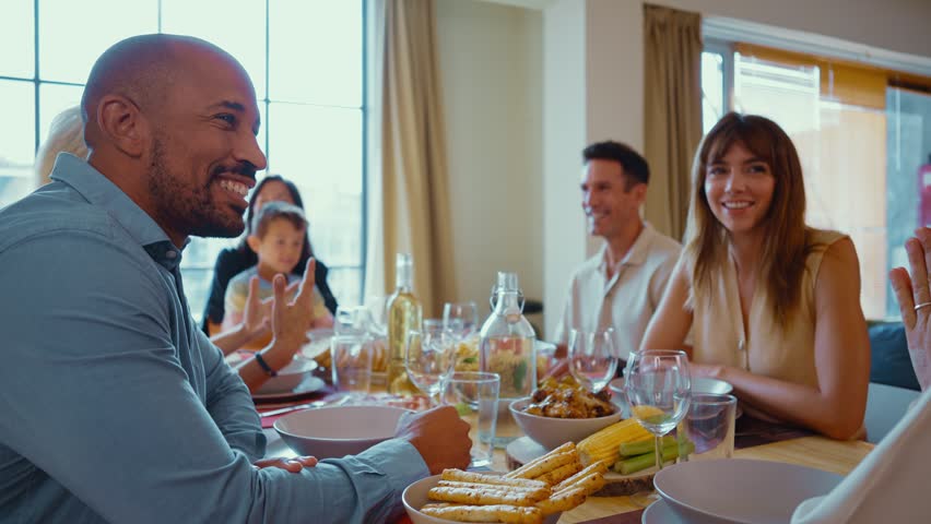 Family and friends reunion at home. Multi-generational family gathering having lunch at home	