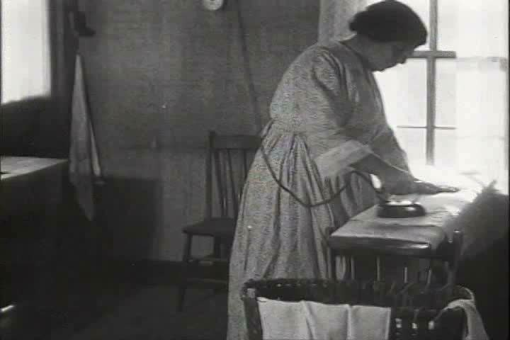 1910s, 1920s - A woman ironing starts a fire