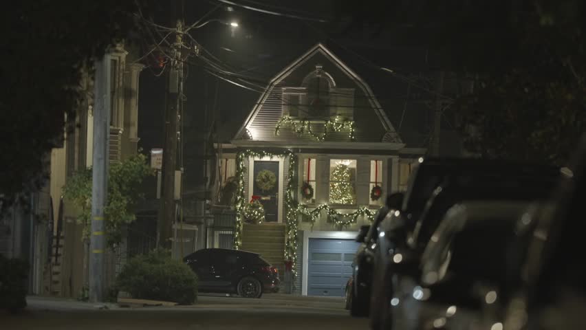 Night street in San Francisco with house facing with Christmas garlands
