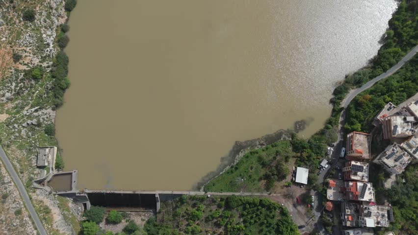 Aerial landscape view of Oyoun El Samak dam in Akkar with wide lake, mountains and peaceful nature