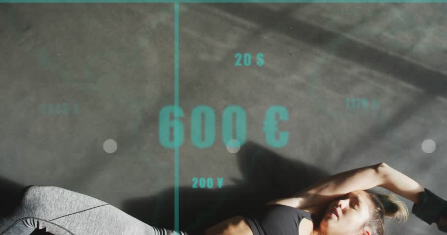 Lying woman on gym mat in sportsbra, leggings, raising gloved hand with trainer-hand, teal overlays. Athlete, boxing, focus, cardio, studio, surface, graphs