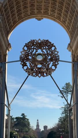 The Olympic cauldron of the Milan-Cortina 2026 Winter Games under the Arch of Peace in the historic center of Milan.