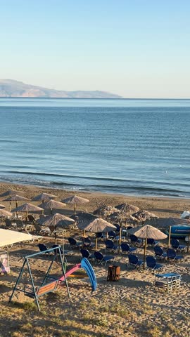 blue chair on Agia Marina beach, Crete Greece, toned