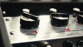 Music studio close up, Close up hands shot of sound engineer using mixing console, remote control for adjusting sound, audio mixer. Musician creates music, makes remix for DJ set. Sound recording - Powered by Shutterstock - Get 15% off with code: PIKWIZARD15