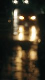 An atmospheric view of city lights at night. Blurred car headlights create a golden bokeh and reflections on the wet asphalt during rain. A melancholic, cinematic, and introspective cityscape - Powered by Shutterstock - Get 15% off with code: PIKWIZARD15