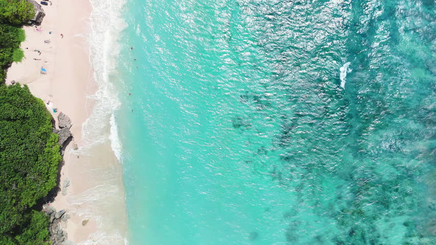 Tropical landscape with luxury beach with blue ocean and waves. Drone view, top down
