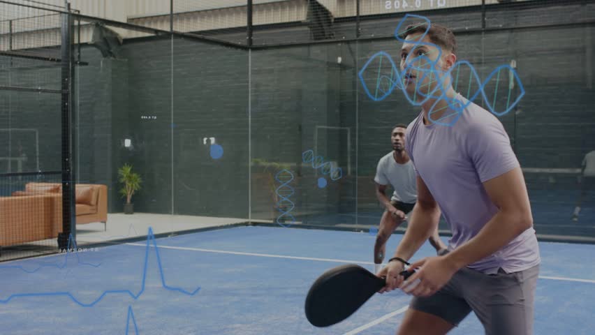 Ball volleying, two male players using paddles, practicing sports drills, showing blue metrics. Court, glass, facility, training, athletes, motion, rally
