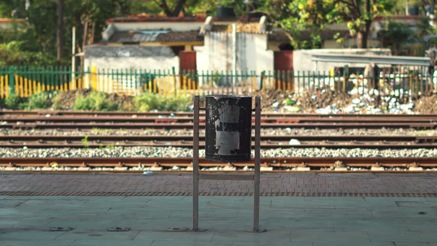 Public Trash Bin on Train Platform in Urban Station