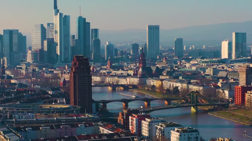 Aerial view around the downtown of the city Frankfurt am Main in Germany , on a sunny autumn afternoon. Beside the main  river