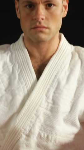 Man practicing karate in fitness studio