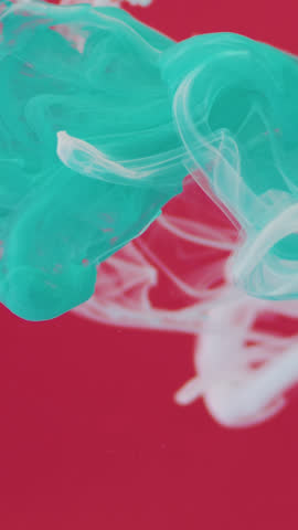 High resolution time lapse footage of vivid white and turqouise paint dispersing gracefully in liquid, forming elegant abstract swirls, soft gradients, and organic flowing textures. The clip delivers rich color interaction, fluid motion, and artistic ink diffusion, making it ideal for creative backgrounds, motion graphics, modern design projects, music visuals, cosmetic branding, title sequences, experimental films, and premium promotional edits that need a bold, sophisticated, and visually captivating abstract atmosphere.