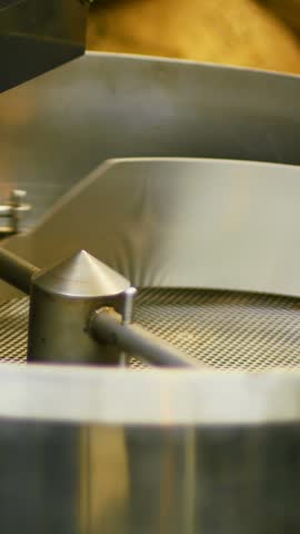 Close-up of coffee grinding machine at coffee shop