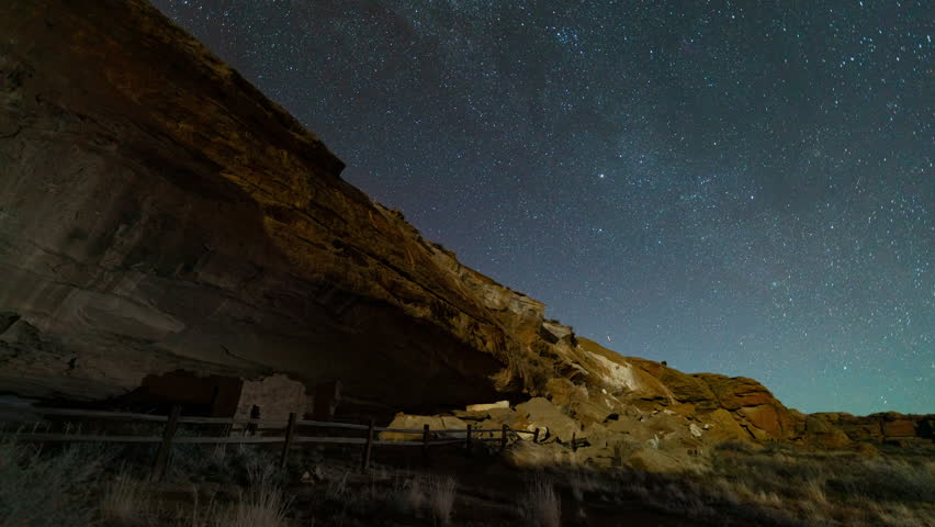 Timelapse of night sky over Native American ruins in Chaco Canyon in New Mexico, USA