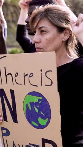 Climate change group of activists protest for global warming in the city - Green environment social movement - Vertical video