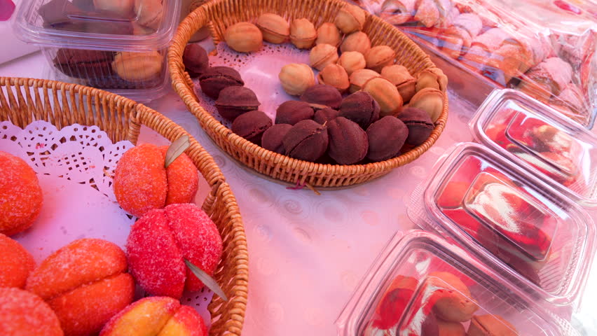 Traditional handmade fruit-shaped cookies and walnut sweets at local market