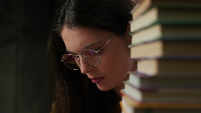 Tired exhausted Caucasian female student taking off glasses suffering eye strain headache young woman study university class overworked girl education stress fatigue vision problem itchy eyes indoors