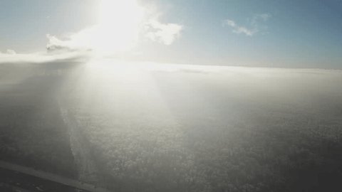 Sideways Flight Drone above Snowy Forest Highway