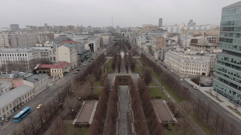 Drone Flying Backward over City Boulevard