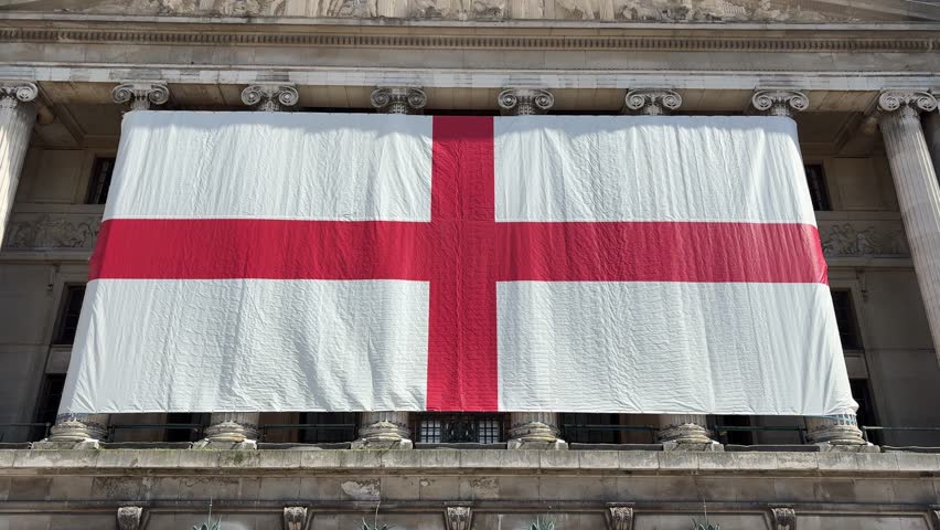 England’s largest St George’s flag displayed at Nottingham Old Market Square on the Council House for St George’s Day, celebrating English heritage and national pride.