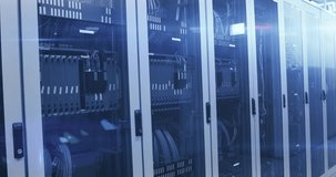 Data center racks filling with HUD sliding in from right, camera panning right and updating graphs. Servers, cabinet, rack, cables, overlay, dashboard, visualization - Powered by Shutterstock - Get 15% off with code: PIKWIZARD15