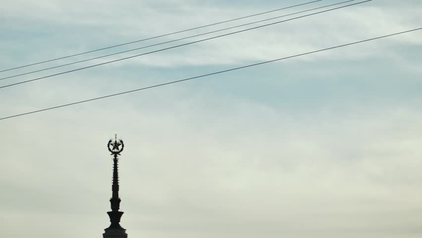 Person ziplining across the sky with a Moscow landmark in the background