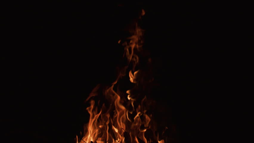 Fire slow motion flames on black background. Fire slow motion burning with natural glow. Fire slow motion blazing cinematic flow. Fire slow motion abstract flame texture.