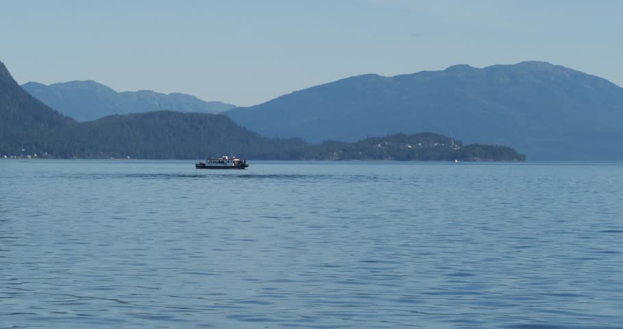 Beautiful scenery of Alaska.Humpback whale slapping the water with her tail.