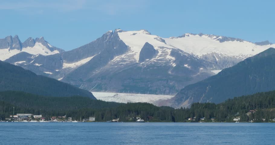 Beautiful sunny summer day in Juneau, Alaska.Mendenhall Glacier and the surrounding mountains covered by snow.