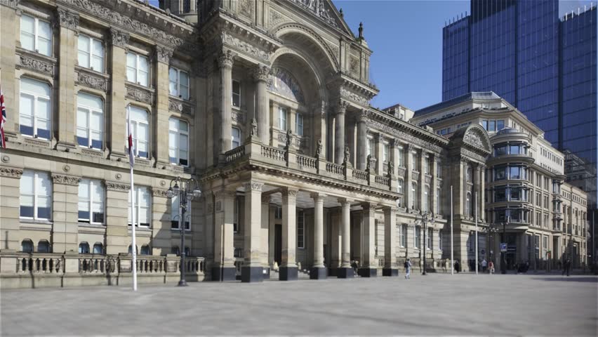 Birmingham Council House Exterior, Victoria Square – Slow Moving Establishing Shot.
Cinematic exterior shot of Birmingham Council House located in Victoria Square, Birmingham, UK. Filmed with a smooth moving camera, this clip captures the grand historic architecture, classical columns, ornate stonework, and central entrance of the iconic civic building. Ideal for use in travel videos, documentaries, urban showcases, news segments, or corporate projects highlighting Birmingham or British heritage locations.