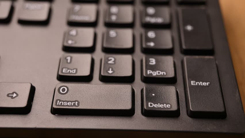 Overhead View of Man Pressing Enter Key on Keyboard for Command Execution