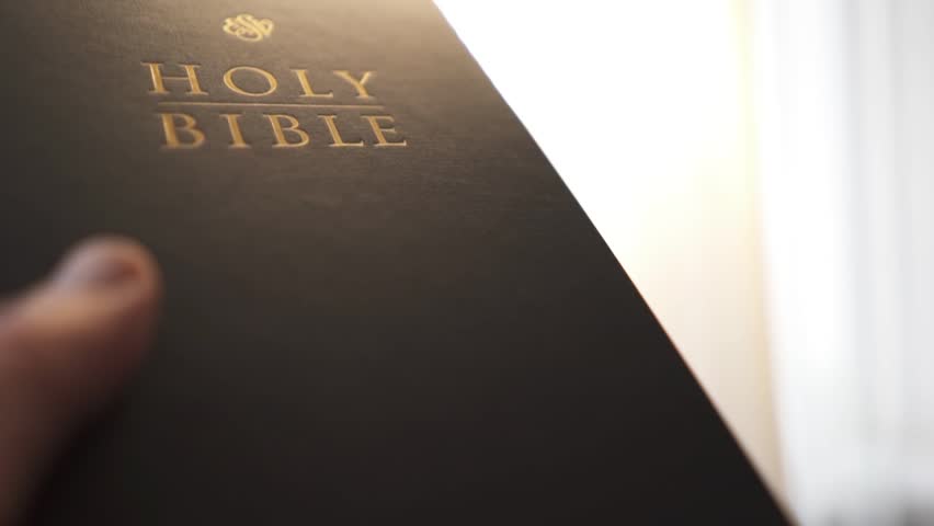 Holy bible in the rays of the sun. Christian biblical concept of wisdom from God Jesus Christ, the Gospel, studying and reading the Scriptures.