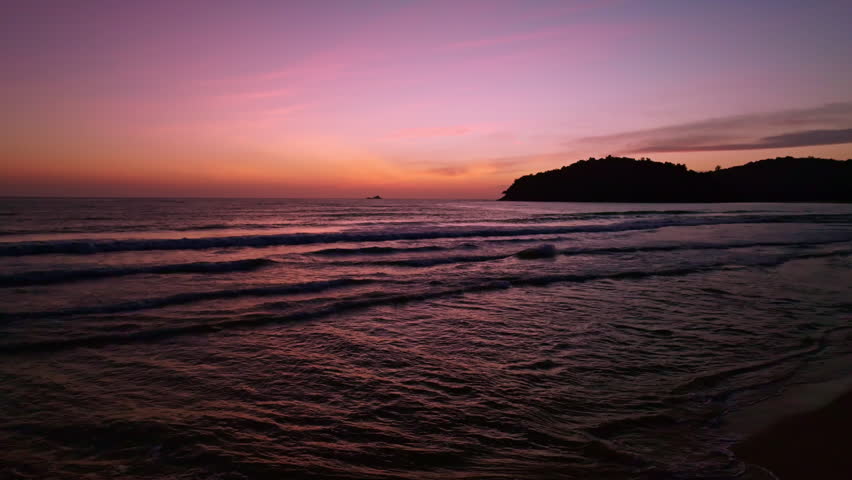 Aerial view Beautiful view sunset or sunrise over sea surface beautiful wave Amazing light twilight sky sunset. Cinematic drone shot dynamic footage beautiful light of nature seascape