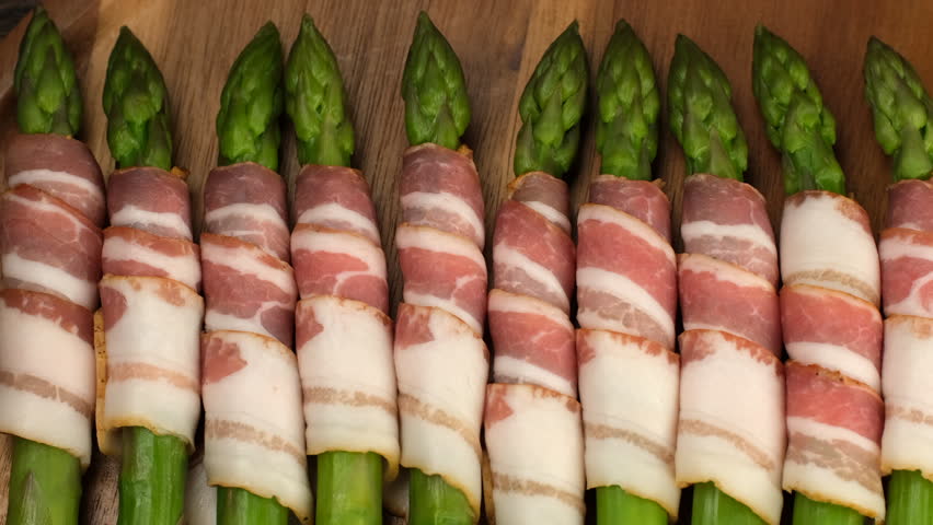 Bacon wrapped asparagus ready for cooking, slider view