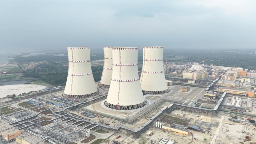 Nuclear power plant cooling towers with industrial complex