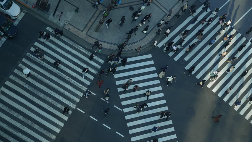 Wide aerial top down view of busy Tokyo scramble crossing intersection