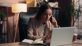Stressed overworked multitask Caucasian business woman talking mobile phone looking in laptop writing notes consulting client female girl businesswoman overload with multitasking job process at office - Powered by Shutterstock - Get 15% off with code: PIKWIZARD15