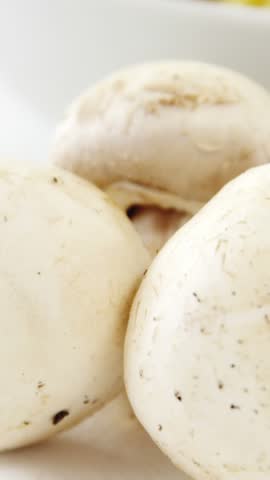 Close-up of mushroom with bowl of pasta