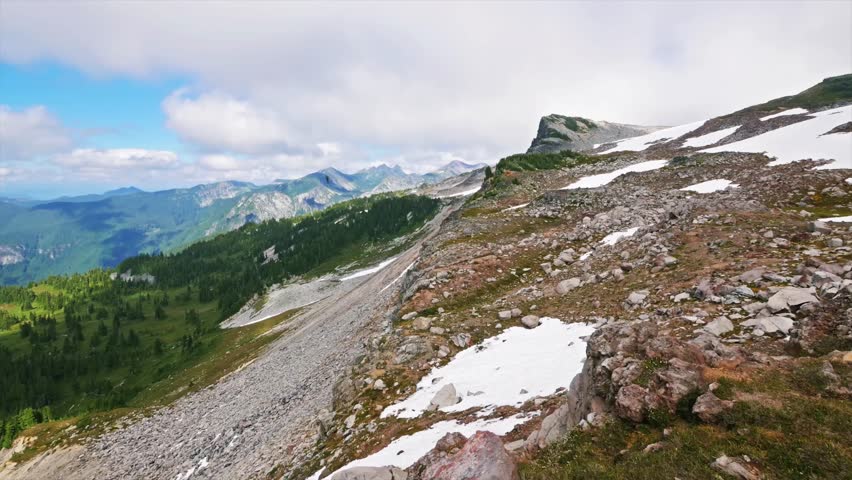A view of the alpine landscape and meadows along the Spray Park Trail, a section of the iconic Wonderland Trail in Mount Rainier National Park.
