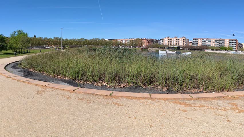 artificial lake area in Santa Perpetua public park, 4K