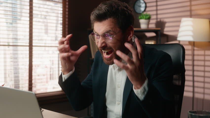 Angry Caucasian business man take off glasses close laptop yelling furious in office 40s businessman male executive taking off eyeglasses closing computer yell feel rage in company bankruptcy crash