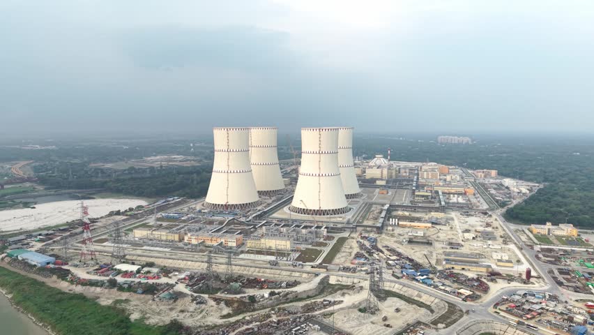 Nuclear power plant cooling towers with industrial site