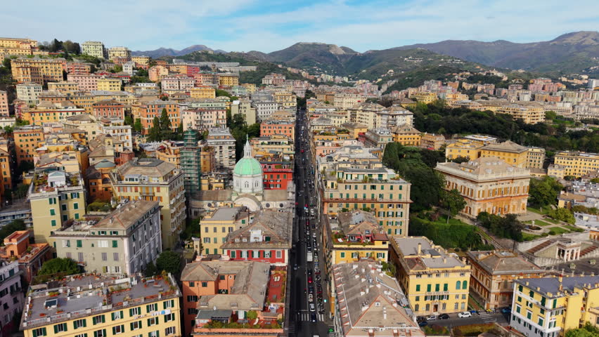 Aerial view of vibrant Genoa, Italy, showcasing colorful buildings and hills