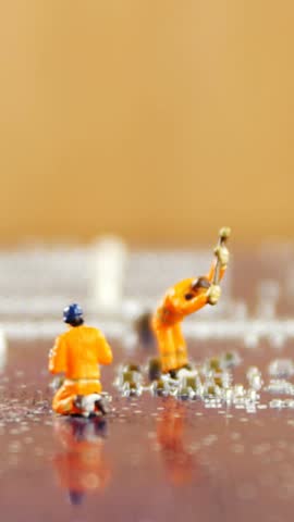 Figurine of manual worker working on construction site 4k